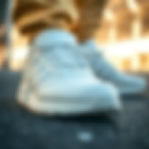 Close-up of Adidas Triple White sneakers showcasing design details