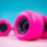 Close-up view of vibrant pink skateboard wheels showcasing their glossy finish.
