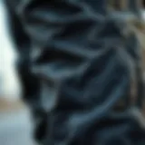 Close-up of textured fabric on black zipper cargo pants