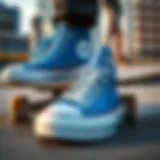 A close-up of blue Converse shoes on a skateboard deck