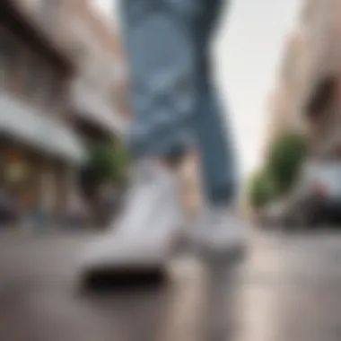 All-white Converse sneakers showcased in an urban skateboarding setting