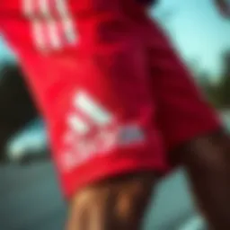Close-up view of red and black Adidas shorts showcasing fabric texture and design details