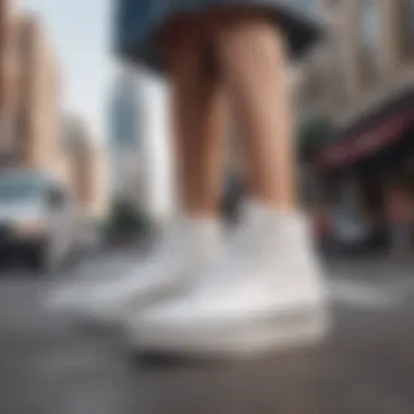 Fashionable outfit paired with white high top platform Vans on a city street