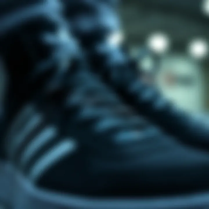 Detailed View of Black Adidas Forum Sneakers A close-up of the white details on black Adidas Forums