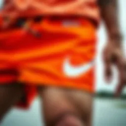 Close-up of vibrant orange Nike shorts showcasing unique design elements