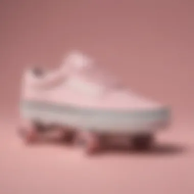 Close-up of powder pink Vans on a skateboard