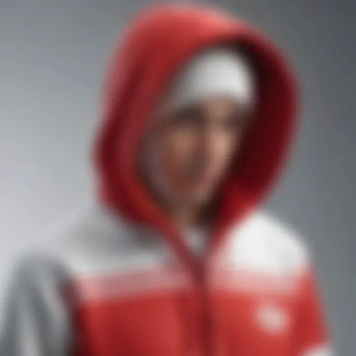 Close-up of the unique design elements of the red and white graphic hoodie.