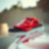 Classic red and white Vans shirt displayed on a skateboard