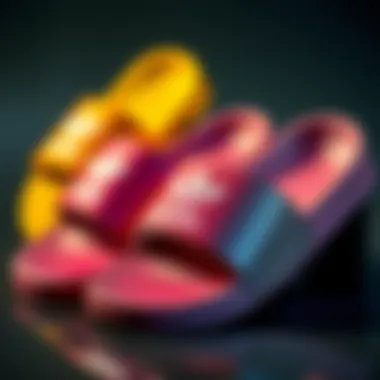 Different color variations of adidas Shmoofoil slides displayed together