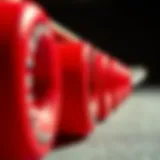 Close-up of vibrant red skateboard wheels with a textured surface.