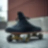 Converse Hi Black sneaker on a skateboard deck