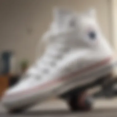 Close-up of white Converse high tops on skateboard