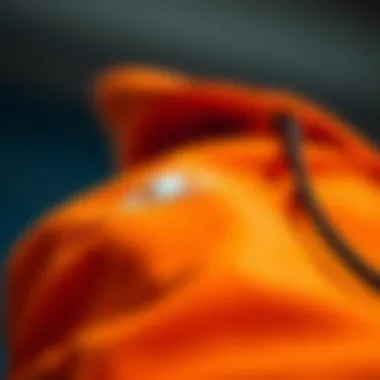 Close-up of the fabric texture of the orange Champion sweatsuit