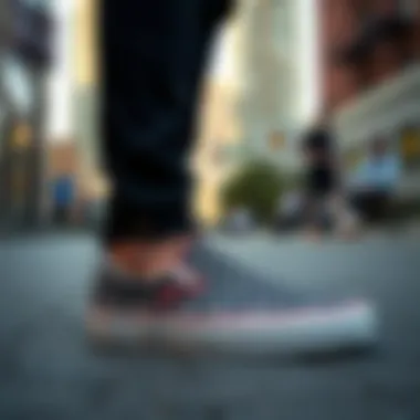 A stylish individual wearing polka dot Vans slip-ons in an urban setting