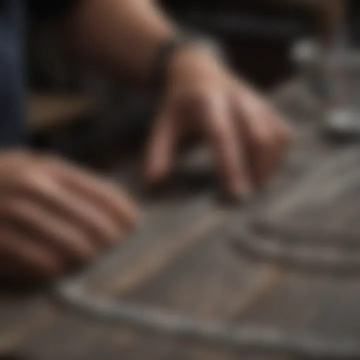 Artisan crafting a silver micro Cuban chain in a workshop