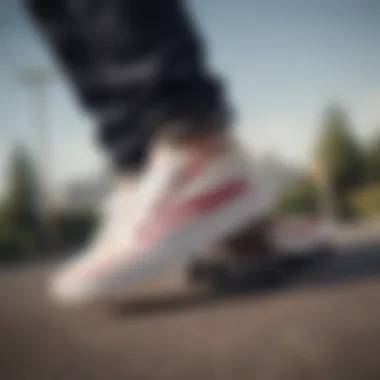 Skateboarder wearing Vans Old Skool White Red Stripe in action