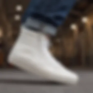 White Leather Hightop Vans in Skateboarding Dynamics Skateboarder wearing white leather hightop Vans in action