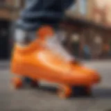 Vibrant orange skate shoes on a skateboard