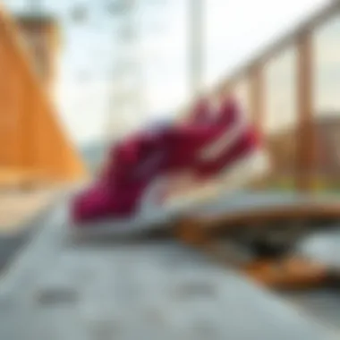 Lifestyle shot of Reebok Club C 85 Burgundy on a wooden skateboard deck.