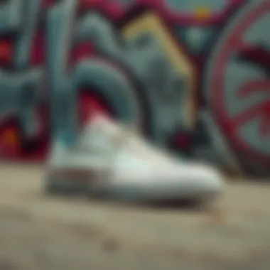 Silver Converse sneakers displayed against a vibrant graffiti wall