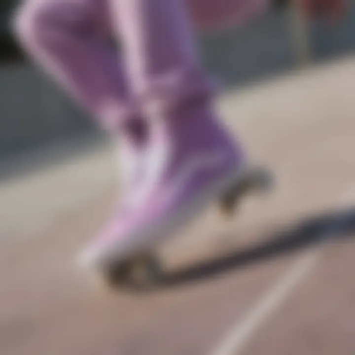 Skateboarder wearing lilac Vans in action at a skate park