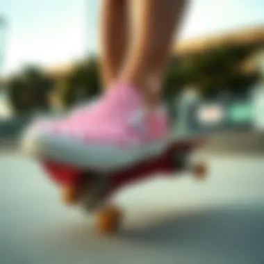 Skateboarder performing tricks while wearing Vans pink checkered slip-ons
