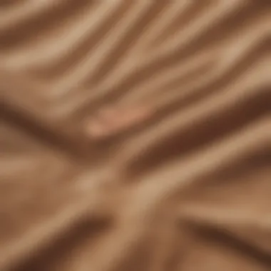 Close-up of the fabric texture of the Tan Nike sweatshirt