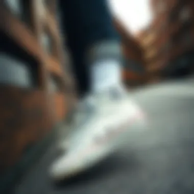 Fashion-forward individual showcasing white tall Converse in urban environment