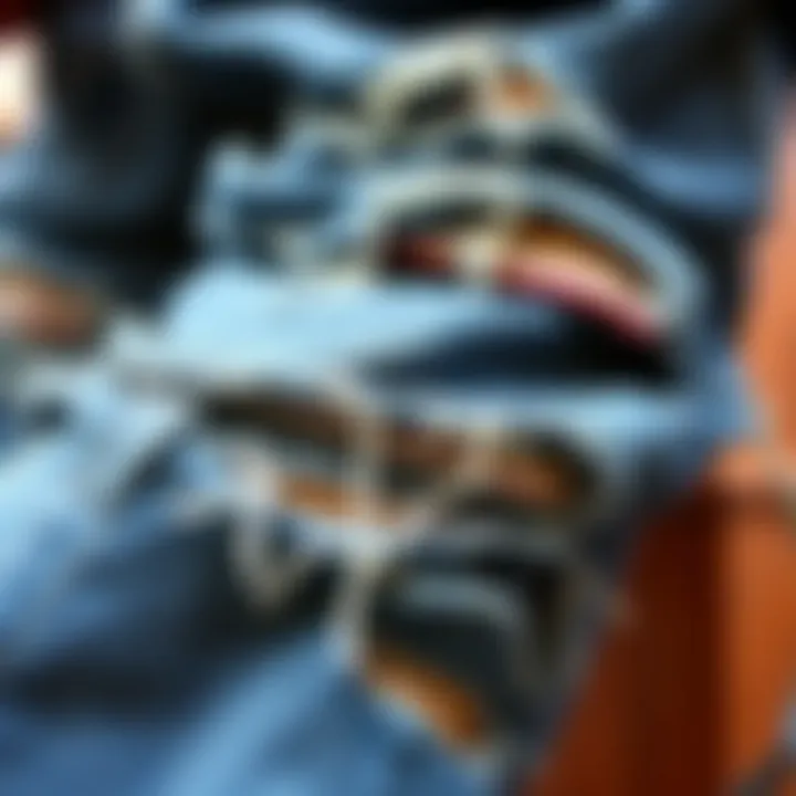 A close-up of distressed skater ripped jeans showcasing unique fraying and patchwork.
