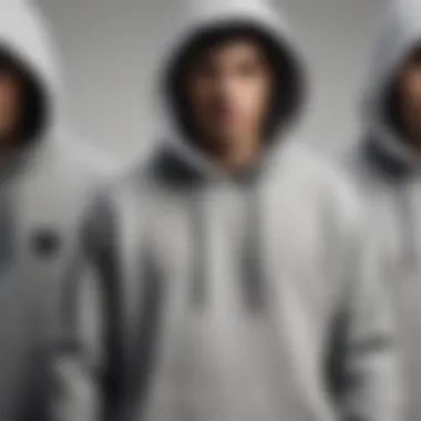 A collection of grey Primitive hoodies displayed together, emphasizing their design variations.