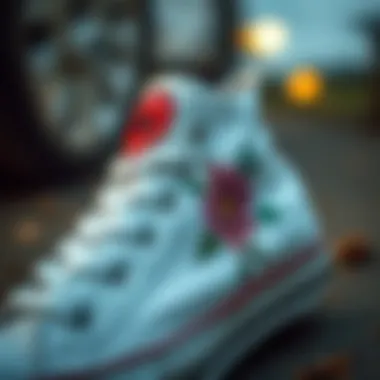 Close-up view of floral design on white Converse sneaker highlighting its artistic details