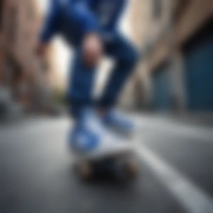 Skateboarder wearing blue and white Adidas shoes in an urban setting