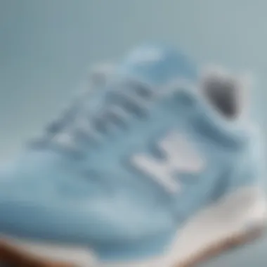 Close-up of light blue New Balance sneakers highlighting their design features