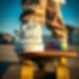 Stylish white Vans with rainbow soles on a skateboard